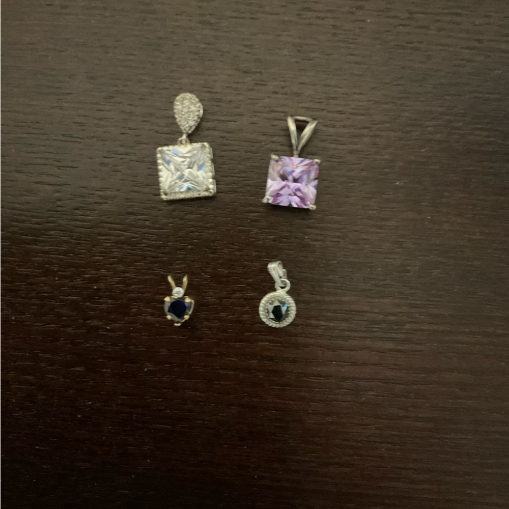 Four loose pendants